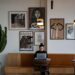 Woman sat in coffee shop on laptop